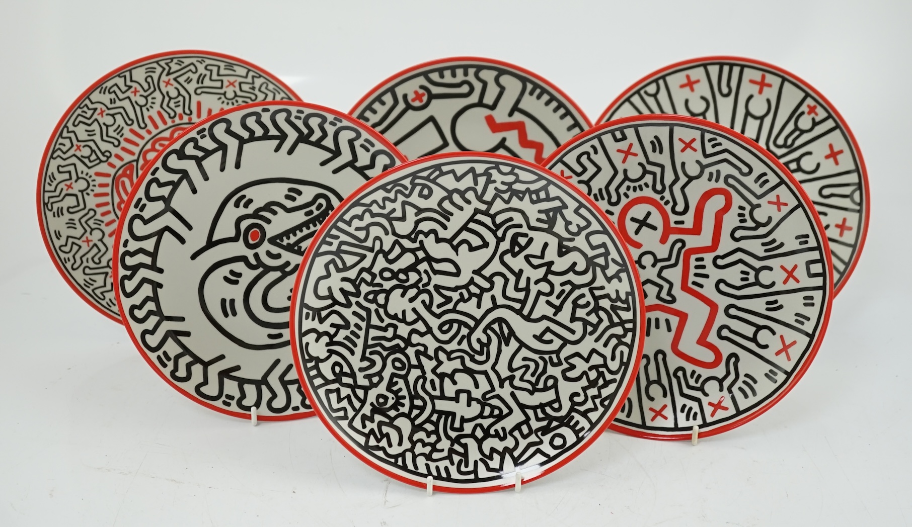 Keith Haring (American, 1958-1990) designs, a set of six Ligne Blanche, Limoges porcelain plates